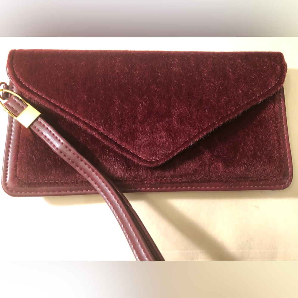 New mark. Burgundy soft textured wallet wristlet with gold accents